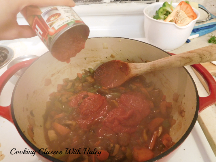 Adding tomato puree while sauteing caramelizes the sugars from the tomatoes to add richness.