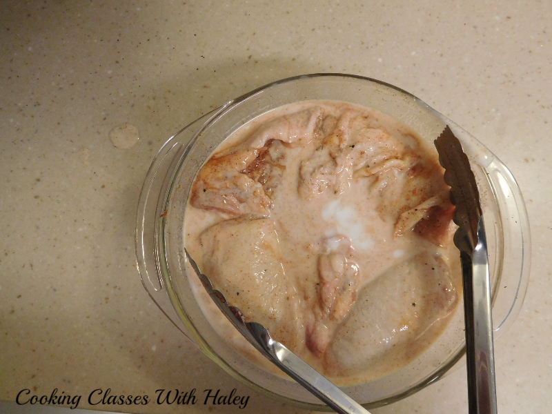 chicken thighs marinating in buttermilk